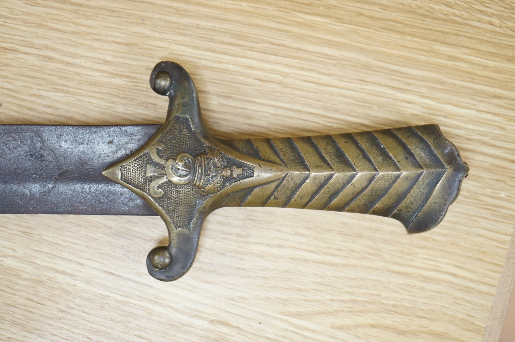 A scarce Germanic Janissary Corps sidearm, produced from 1729-31, broad single edged blade, 65cm, etched in panel with crowned cipher (faint), regulation cast brass hilt with crowned cipher and chevron grip